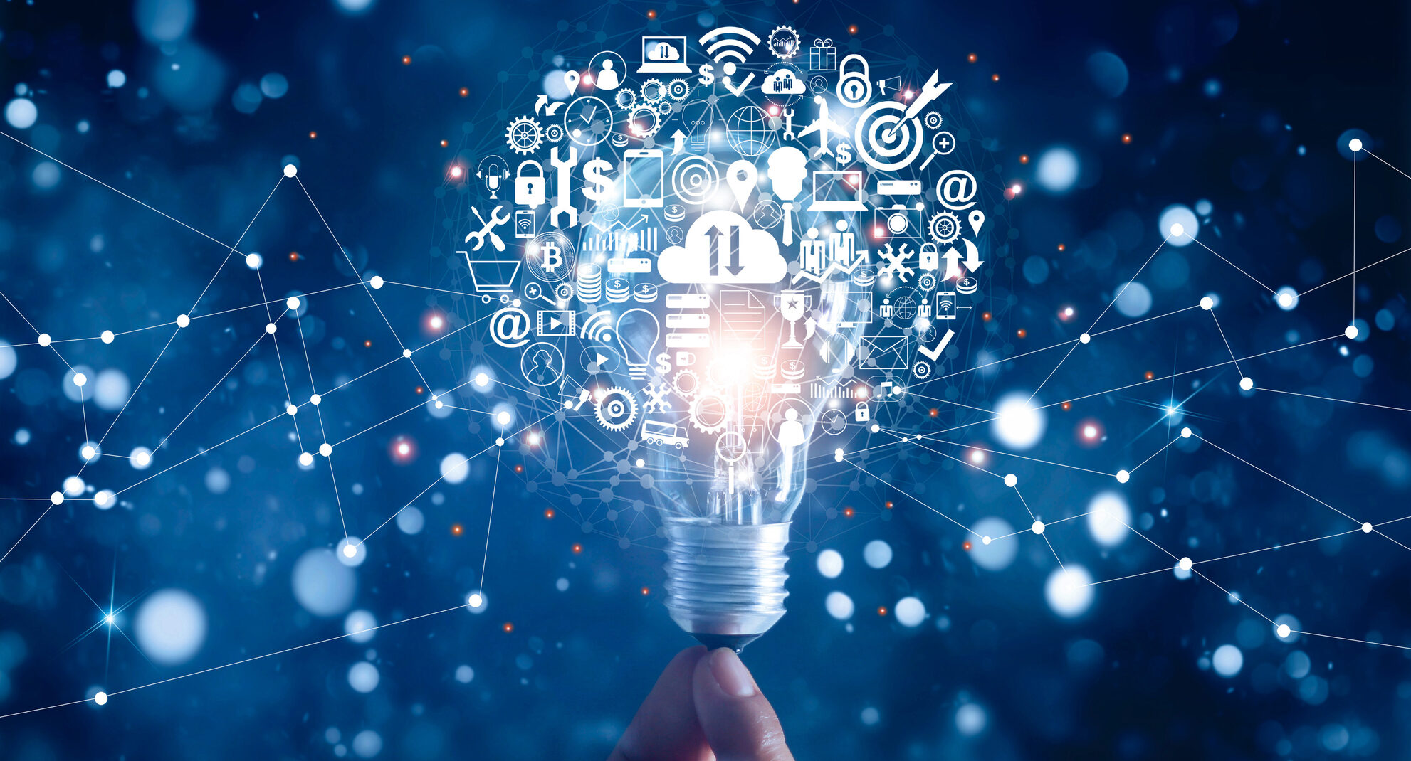 Hand holding light bulb and business digital marketing innovation technology icons on network connection, blue background Staff Meeting